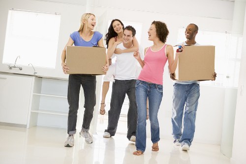 Professional packers handling boxes in Storage Sutton