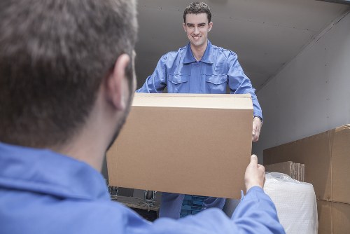 Professional team handling furniture pick-up in Sutton storage